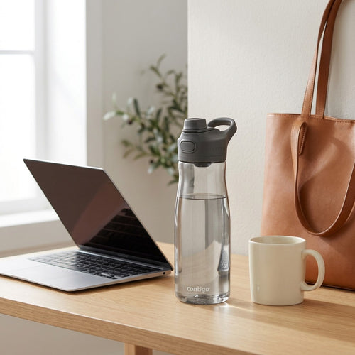 Contigo Cortland 2.0 32 oz water bottle on a desk next to a laptop, coffee mug, and tote bag.