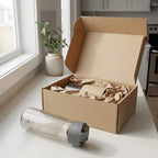 Contigo Cortland 2.0 Water Bottle in Sake unboxed next to protective paper-lined shipping packaging.